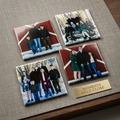 Four family photos on a textured surface with a gold plaque reading 'Moments Held Close'.